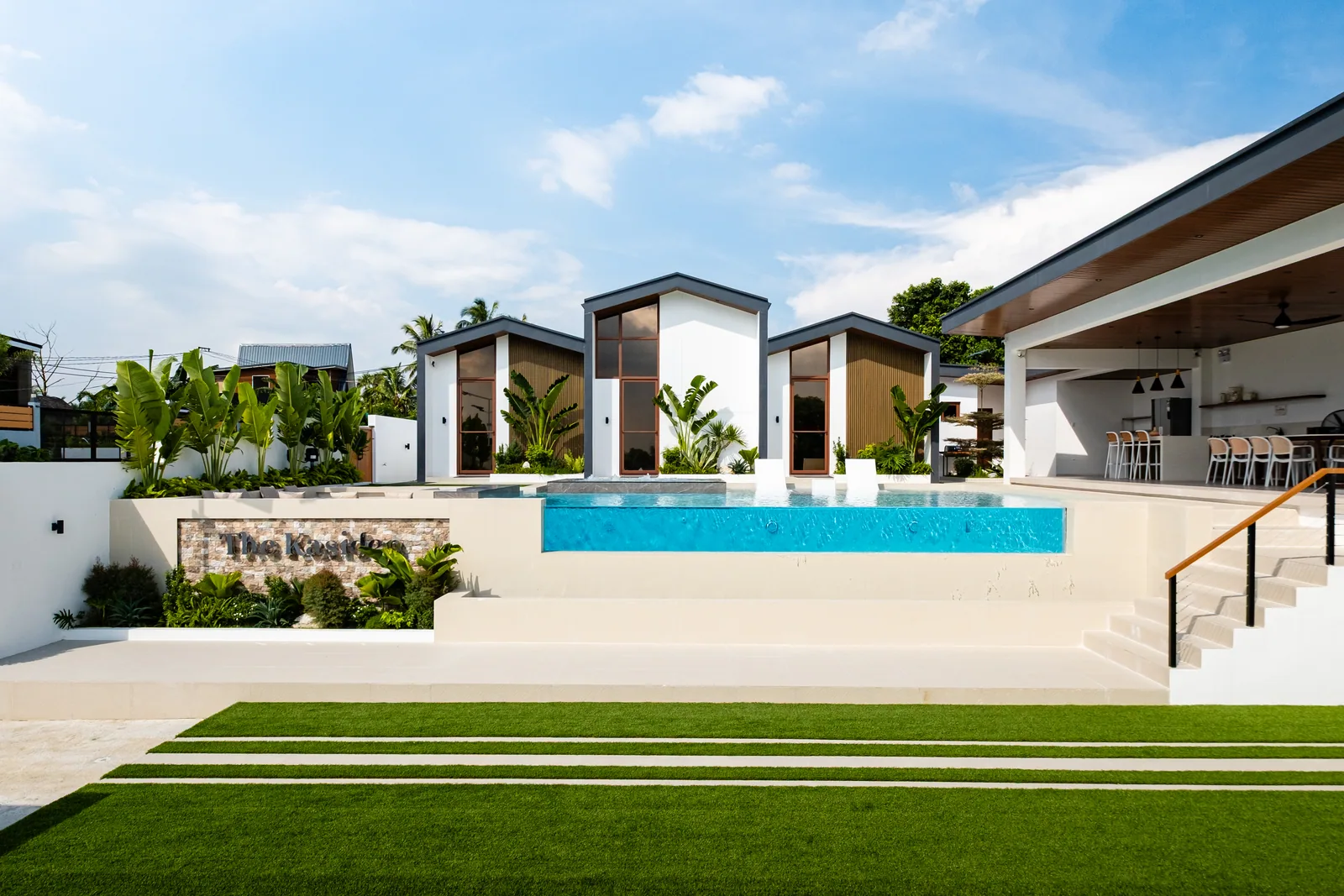 Front view of The Kasiden Private Resort with infinity pool and modern villas.