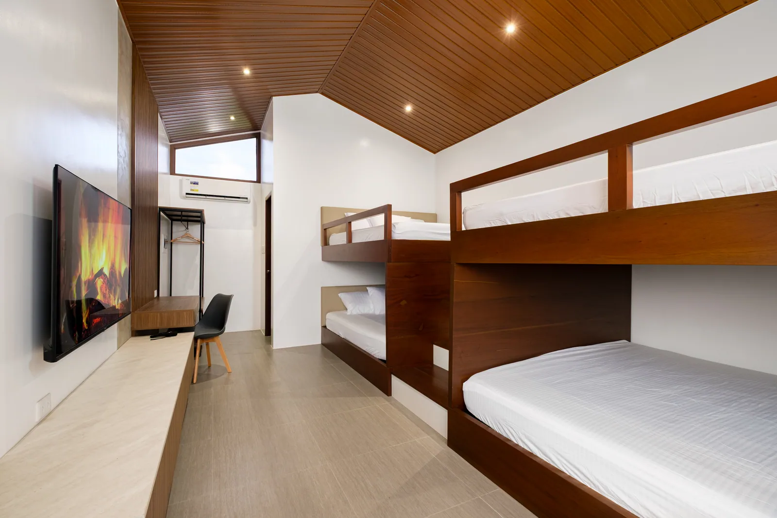 Spacious family villa featuring four king-size beds, air conditioning, smart TV, and modern interiors at The Kasiden Private Resort in Alfonso, Cavite.