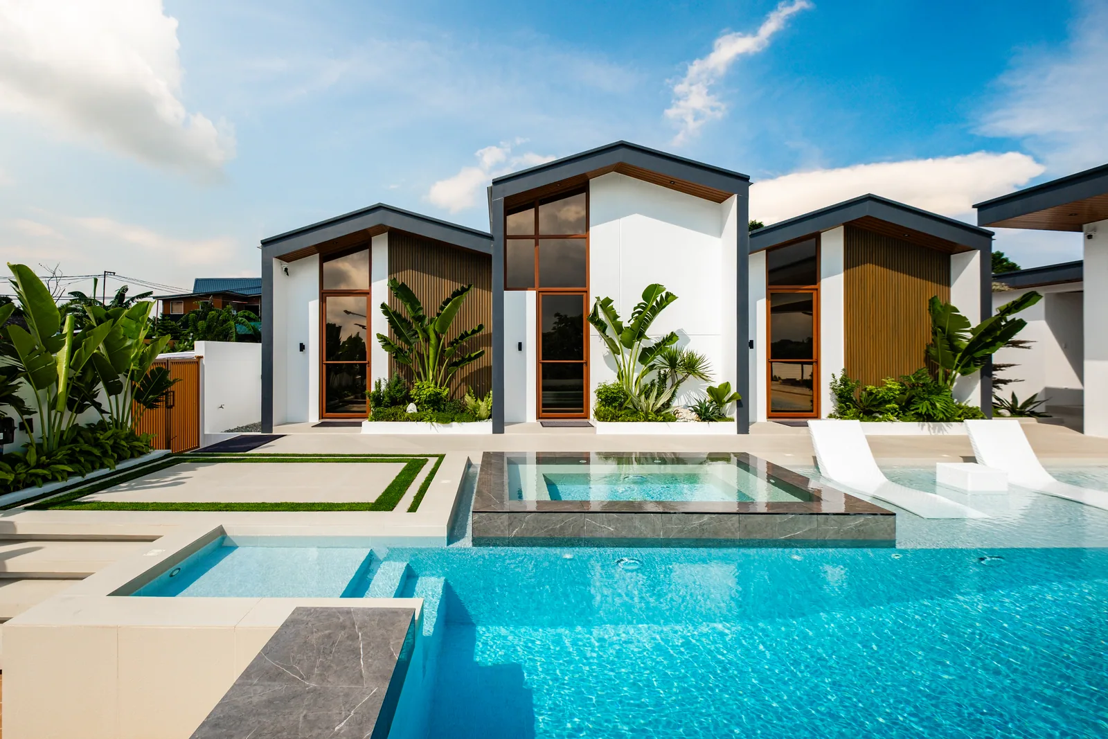 Modern villas overlooking the infinity pool and jacuzzi.
