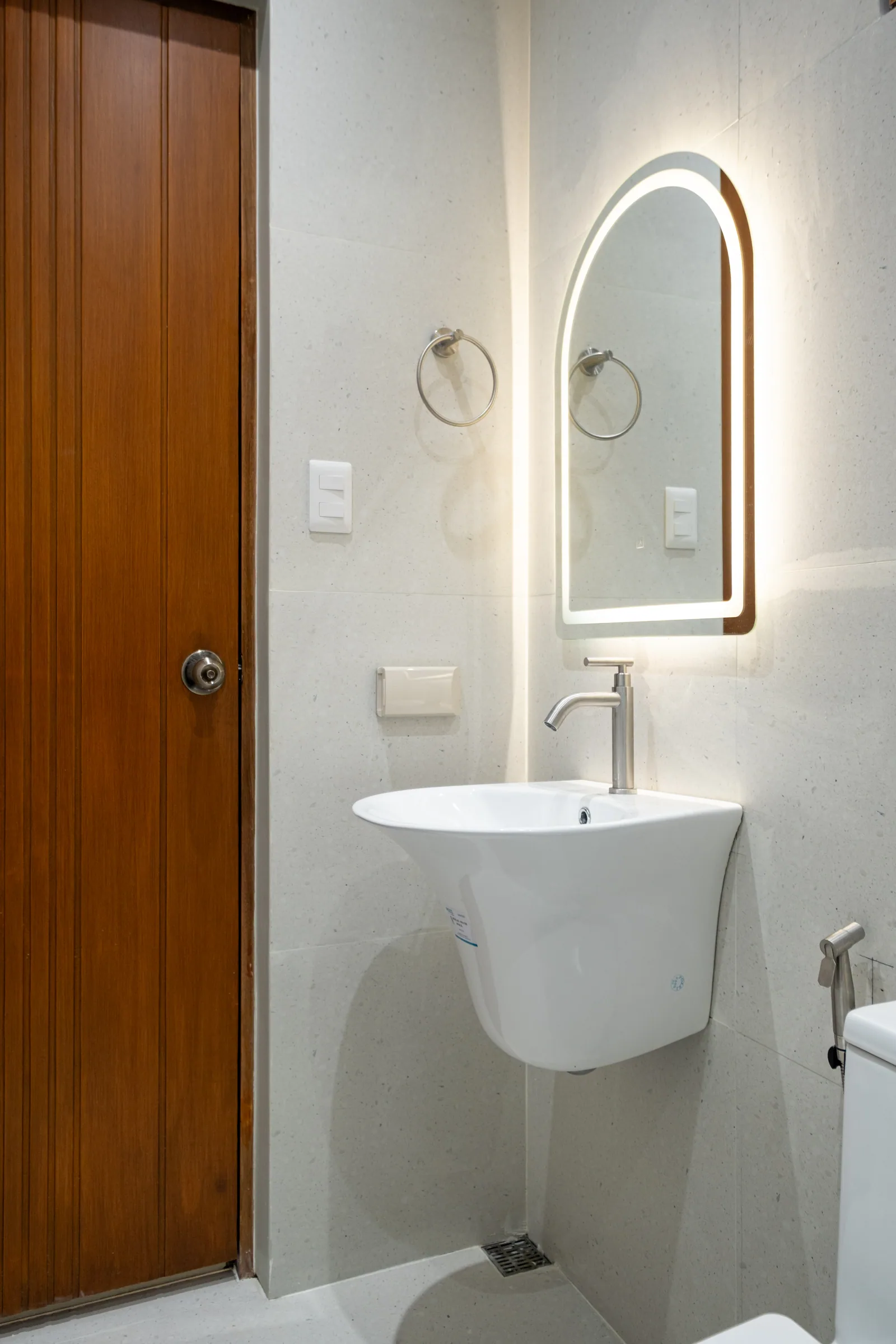 Contemporary bathroom vanity with illuminated mirror, modern sink, and premium finishes at The Kasiden Private Resort.